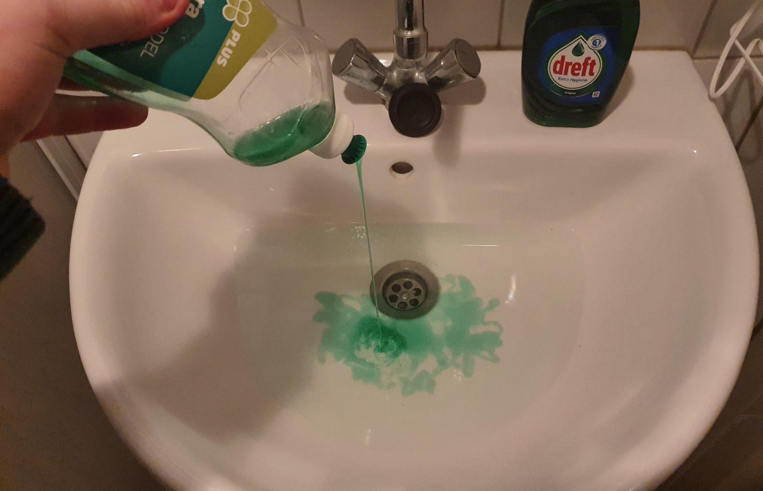 How to unclog a sink with dish soap and hot water